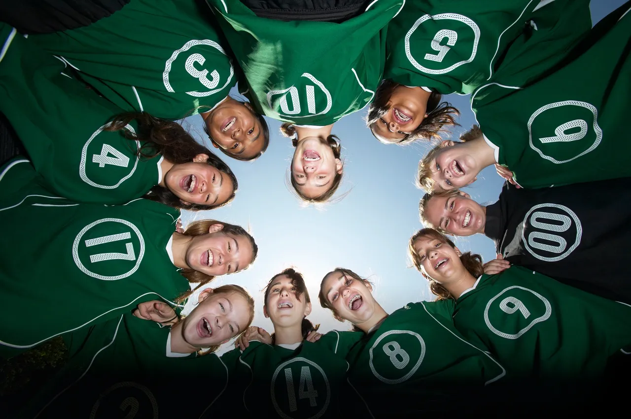 Girls football huddle A girls football team in a huddle