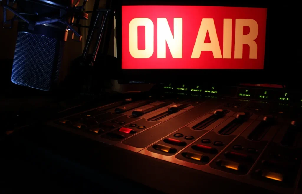 A recording studio with an 'On air' light on
